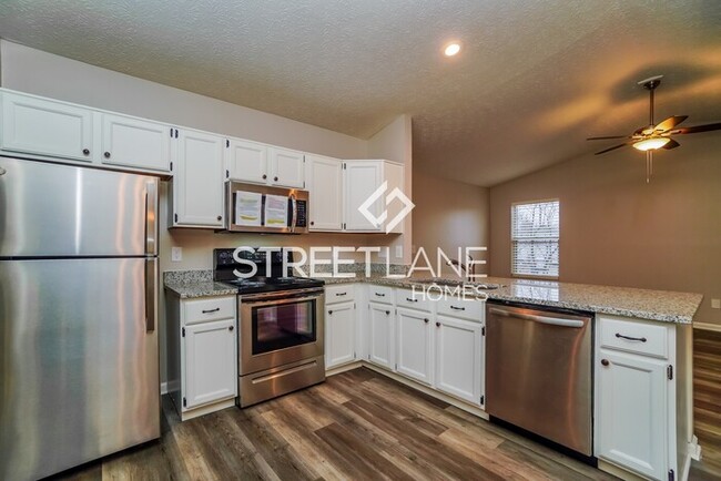 Building Photo - REDUCED- Now offering $1000 off first full...