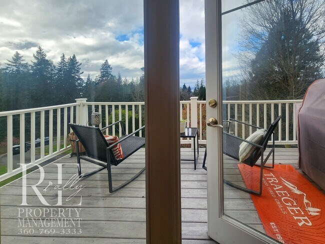 Building Photo - Light-Filled View Home with Vaulted Ceilings & Warm Wood Finishes