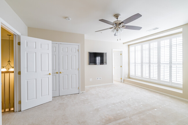 Spacious master bedroom with two large closets (one walk in closet) ceiling fan with remote, large windows with plantation shutters and flat screen HD TV included with rental. - 22785 Settlers Trail Terrace