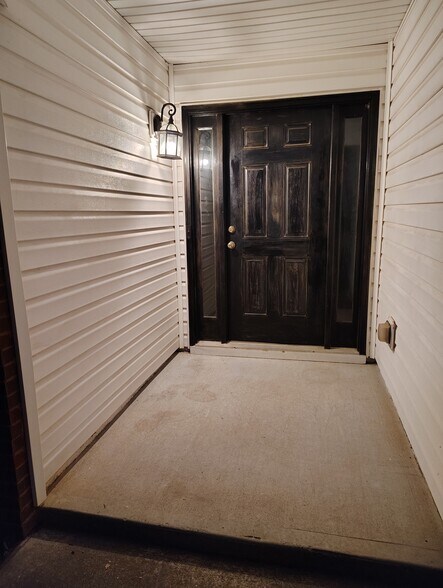 Front door with cover - 5679 Post Mill Ct