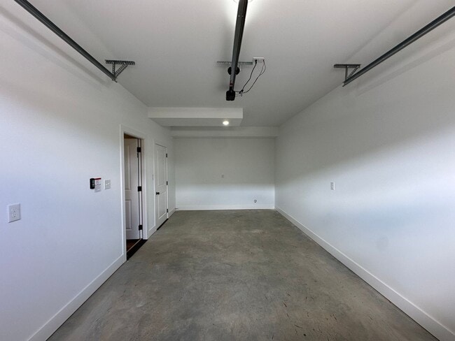 Building Photo - Beautiful new townhouse with garage! First month is free!