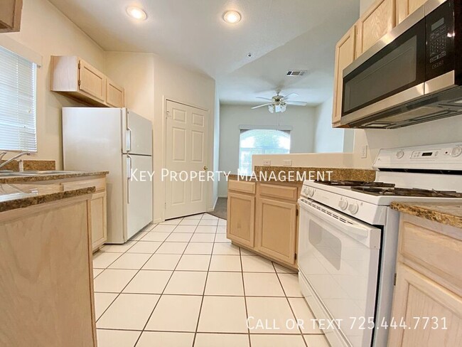 Building Photo - 2 BED 2 BATH UPSTAIRS CONDO  WITH 1 CAR GA...