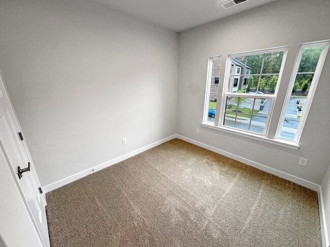 Building Photo - Spacious 3-Bedroom Townhome with Finished ...