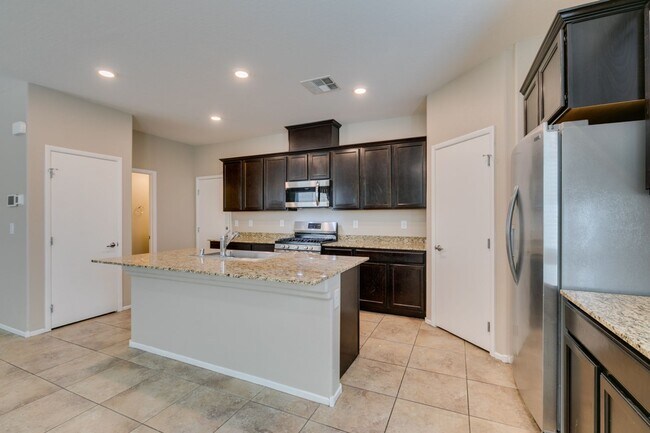 Building Photo - Spacious Townhouse with Loft & Rare 3-Car Garage!