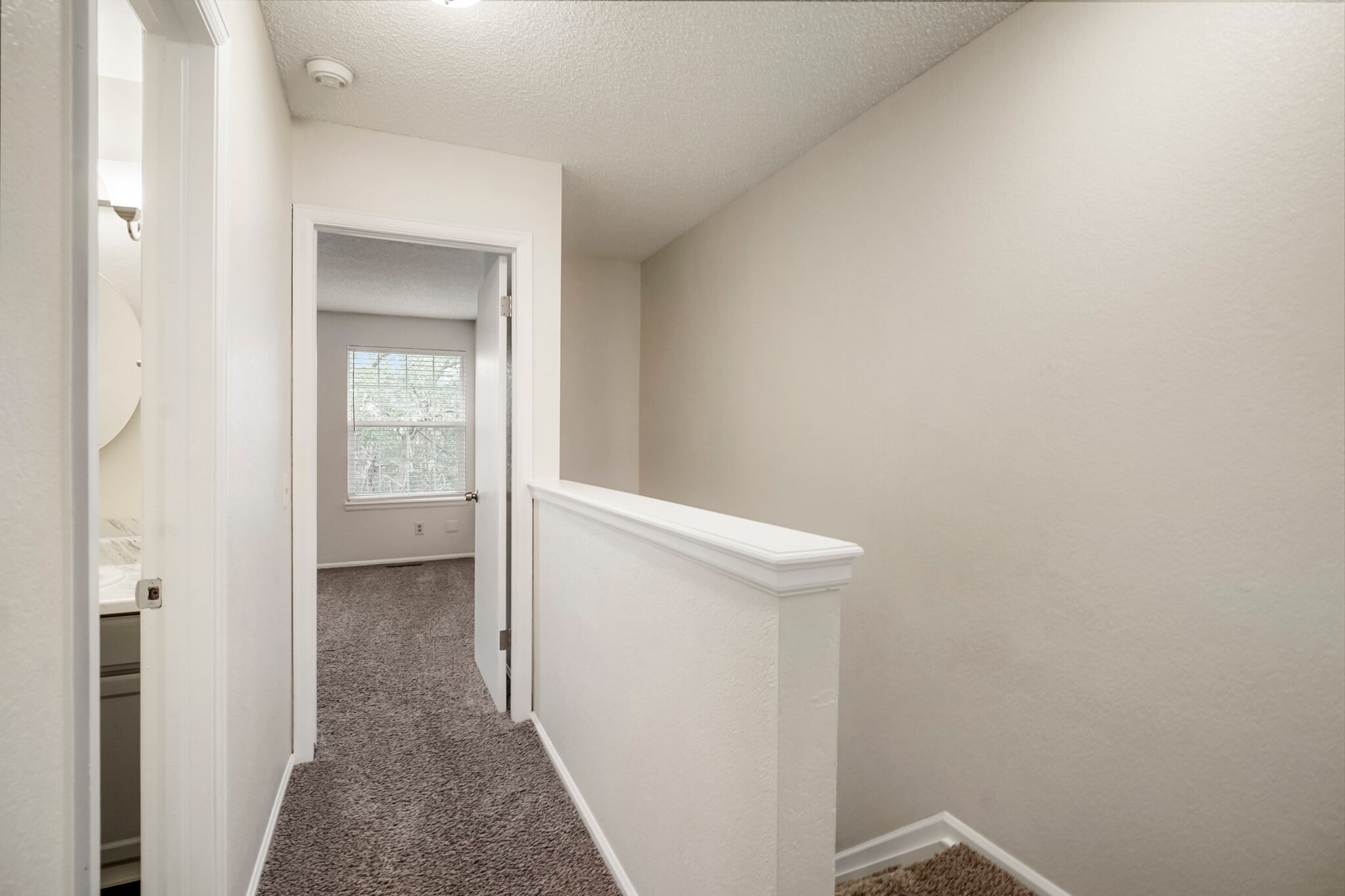 Wide hallways between bedrooms on upper floor - 11554 Community Center Dr