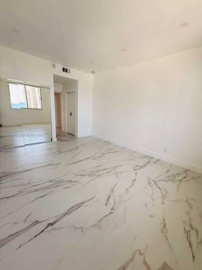 Building Photo - 19370 Collins Ave