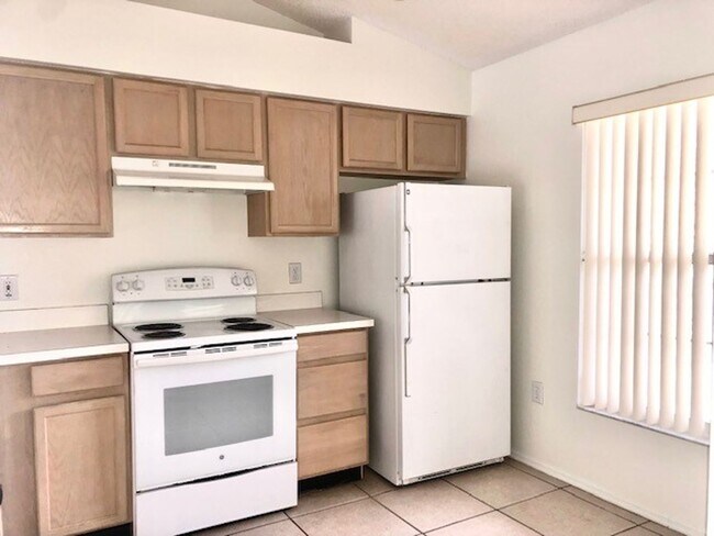 Building Photo - Nice 2X2 located on 2nd floor- Tile & lami...