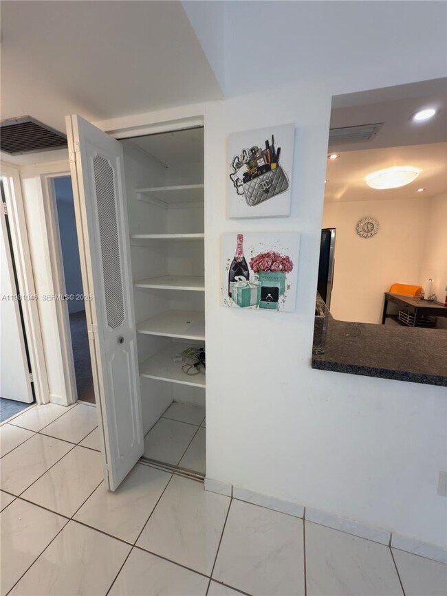 Building Photo - 3675 N Country Club Dr