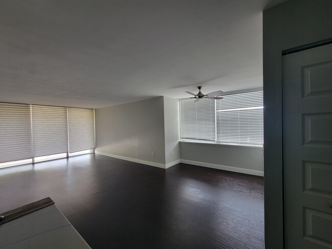 Spacious living and dining room with double balcony outside - 13120 SW 92nd Ave