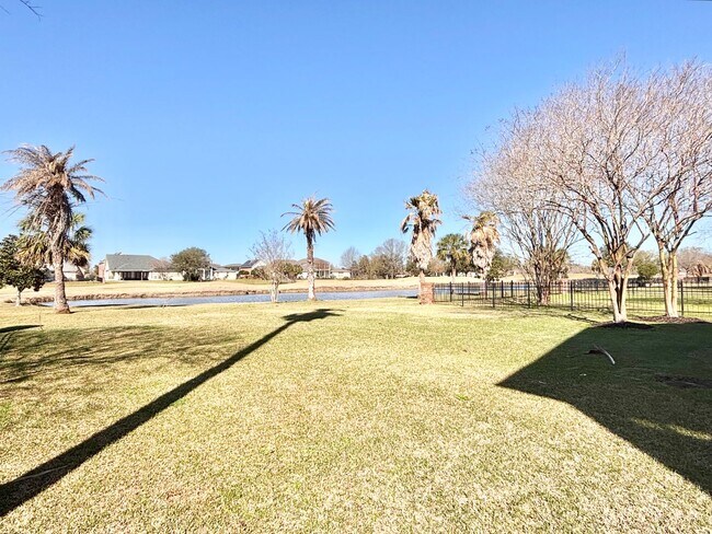 Building Photo - Stunning 5-Bedroom Home with Breathtaking Lake & Golf Course Views – Pelican Point Subdivision