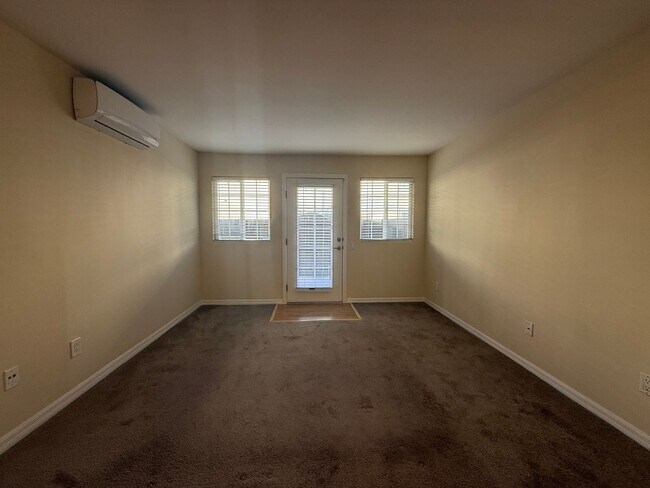 Building Photo - Upgraded Condo with Private Patio, AC, Pool, Gym, and Covered Parking in Gated Community