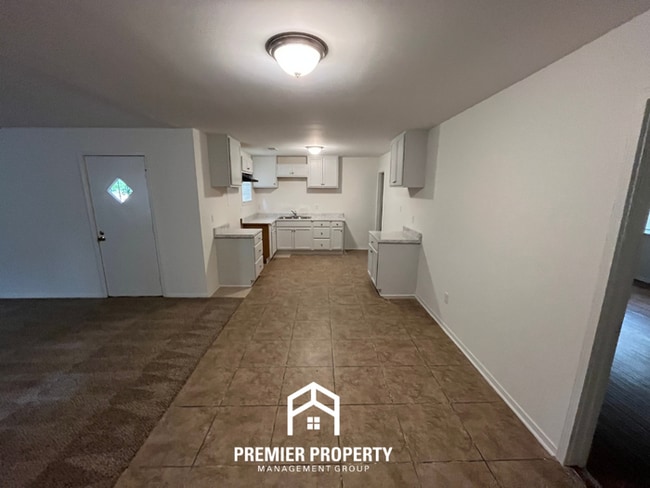 Building Photo - Spacious 3BR/2BA Home with Den & Living Room | Brick Fireplace & Large Yard