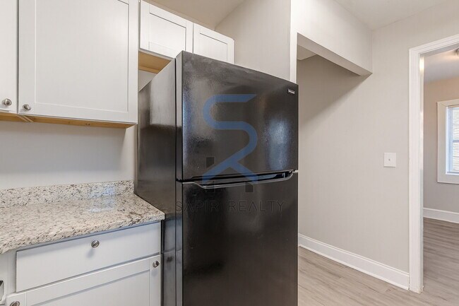 Building Photo - Move in before December 31st and choose your reward: a $250 Amazon Gift Card or a 55" Smart TV!