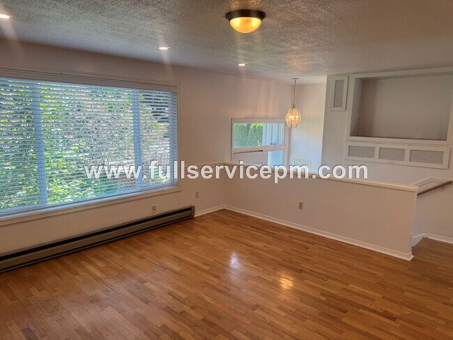 Building Photo - Spacious 4-Bedroom Upper-Level Home with Fireplace, Bonus Room & Large Deck