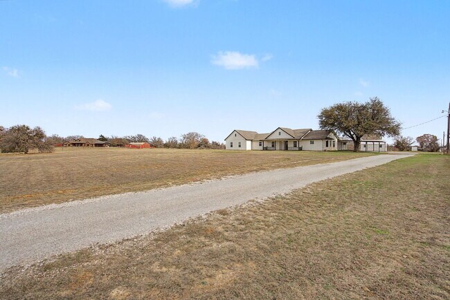 Building Photo - “Farmhouse Charm Meets Modern Luxury on a Serene 5-Acre Lot!”
