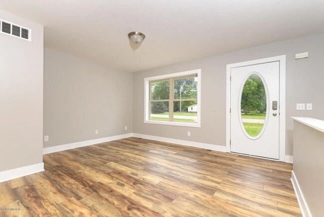 Building Photo - Spacious 3BR Duplex with Finished Basement & 2-Car Garage in Otsego