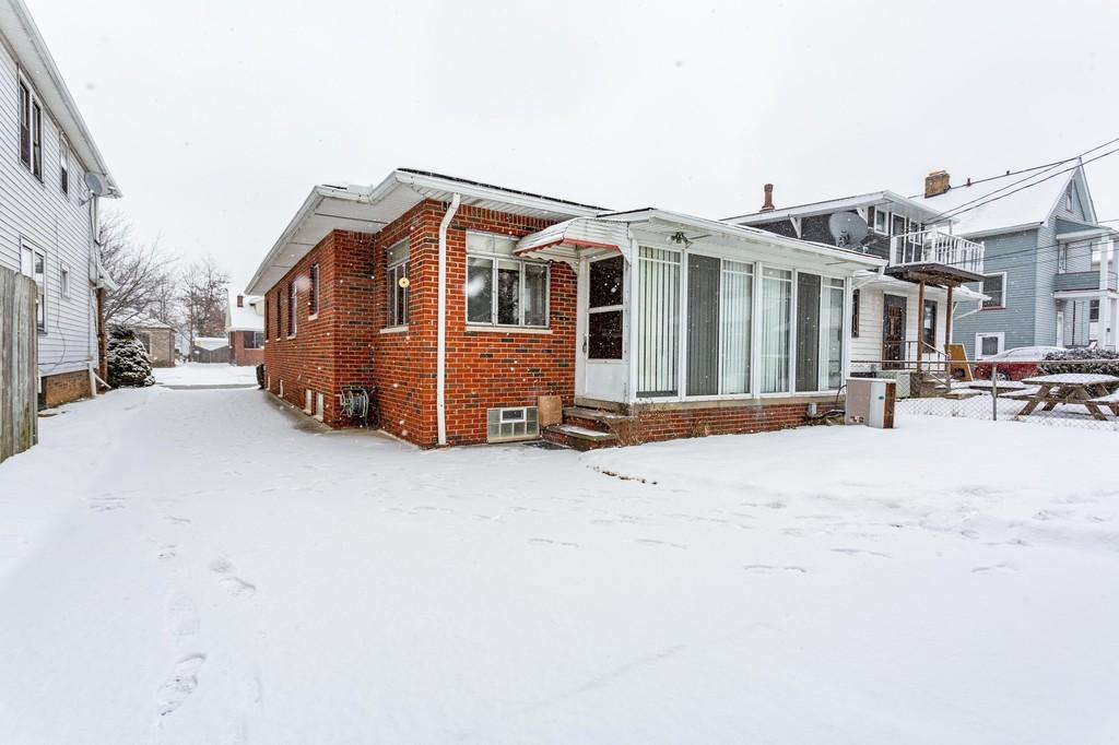 Three season room before restoration. - 2186 Chesterland Ave