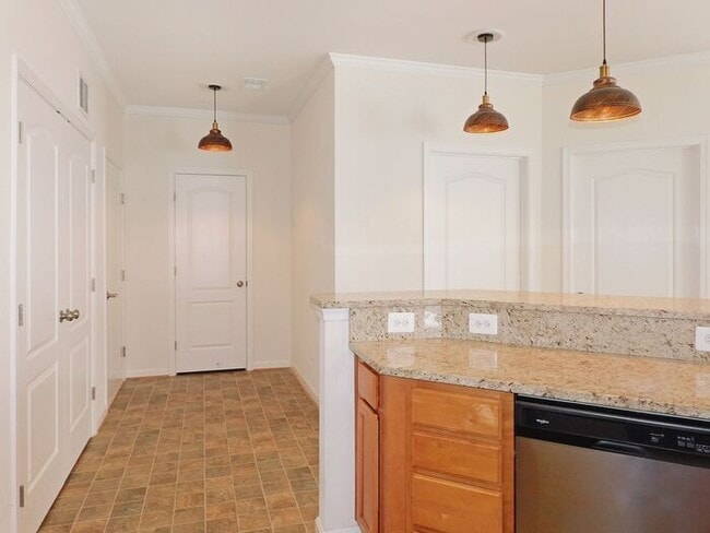 Building Photo - Pet Friendly Condo with Private Balcony and 1 Car Garage