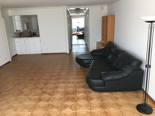 Living area looking to kitchen cut-out (left) and entry area (right) - 969 Hilgard Ave