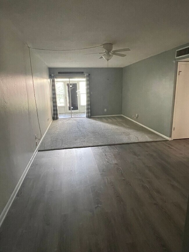 Building Photo - 55+ Charming first-floor condo nestled in ...