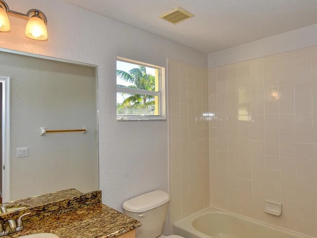 second floor guest bathroom with tub - 1162 Imperial Lake Rd