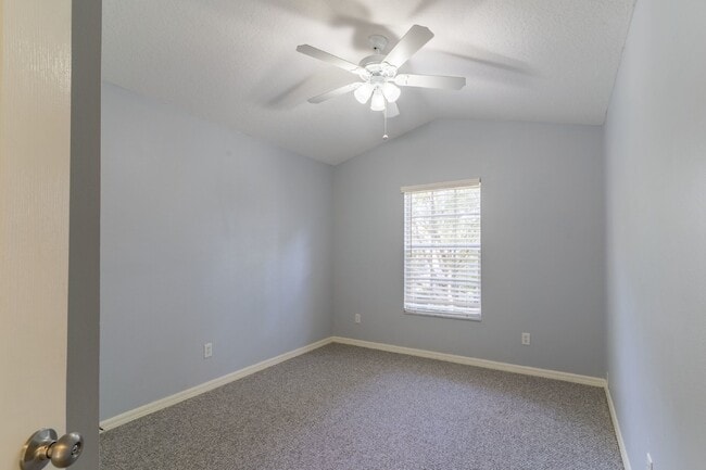 Building Photo - Beautiful 4/2 home Located on a tree lined street in the gate of country club community of the Hu...