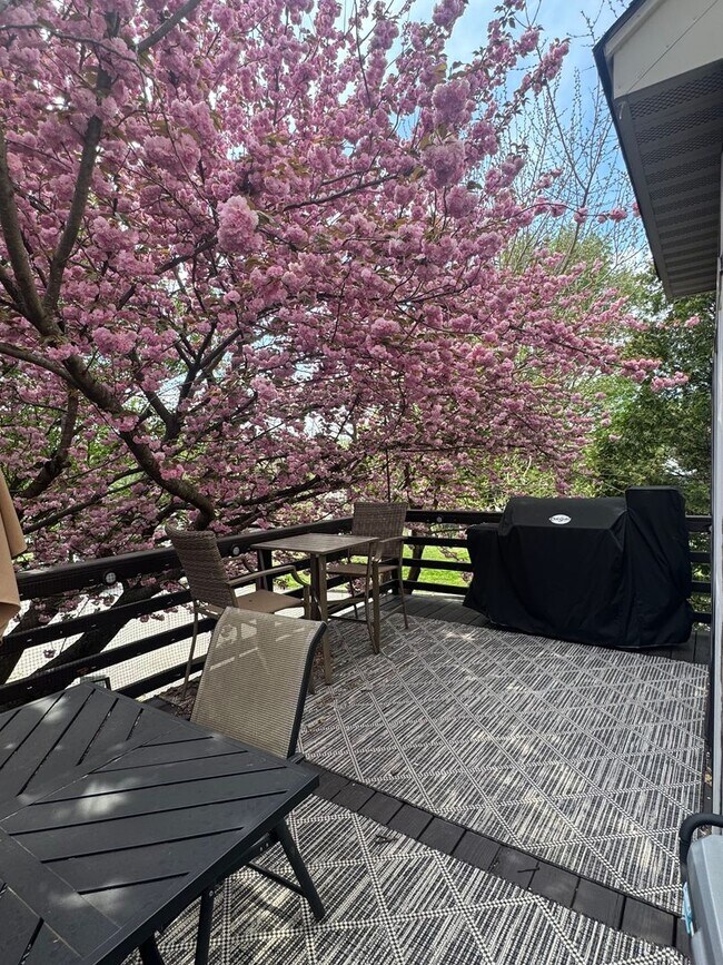 Building Photo - Stunning 3–4 Bedroom Townhome in Private Community | Garage + EV Charger | Deck with Tree Views