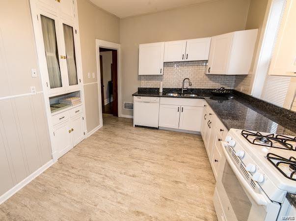 Large Kitchen with all white appliances and subway tile - 4507 S Grand Blvd