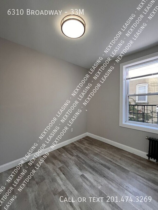 Building Photo - 6310 Broadway-33M