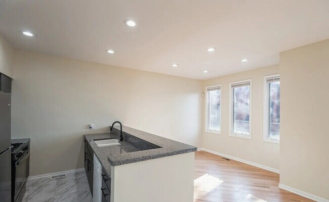 Building Photo - Upscale Living at Its Finest