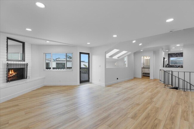 Building Photo - COMPLETELY REMODELED, BRIGHT & AIRY, TRI-LEVEL HOME W/ TOP-FLOOR GREAT ROOM LIVING SPACE, 2-CAR G...