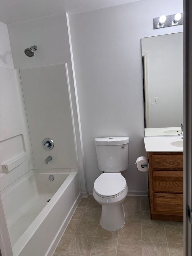 Building Photo - Partially Furnished - Bright & Spacious 2BR/1.5 BA CONDO - End-Unit w/ 2-Car Garage, Appliances, ...