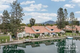 Building Photo - Adorable WATERFRONT Gated Lakeside Villas ...