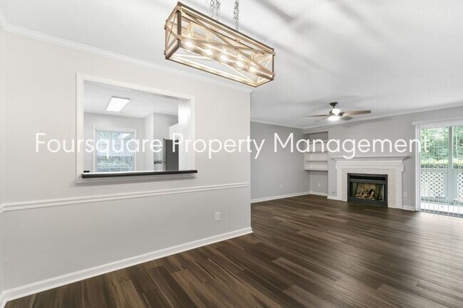 Building Photo - Charming 1st-Floor End-Unit Condo with Gas Log Fireplace, Private Back Porch & Community Pool – T...