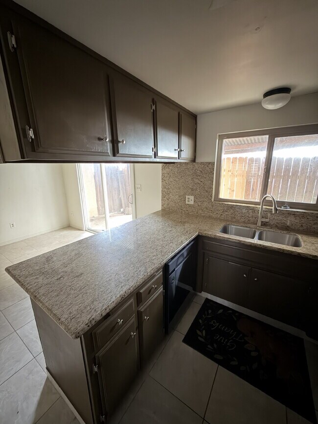 Building Photo - Spacious Two-Story Townhome with Remodeled Bathrooms, Private Patio & Community Pool