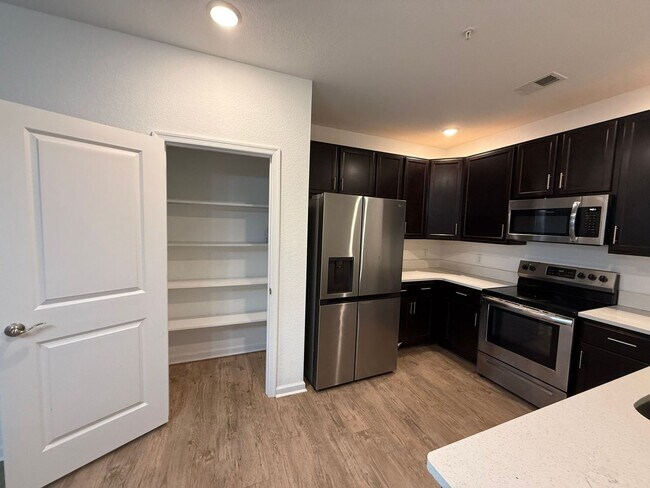 Building Photo - Beautiful New Build Condo – Convenience Meets Comfort