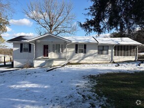 Building Photo - 3 Bedroom Home with Sunroom and Carport on...