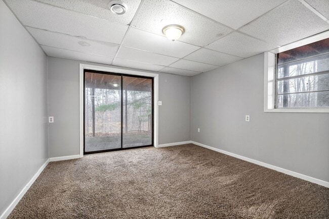 Building Photo - Lovely home on beautiful, wooded corner - Just Reduced