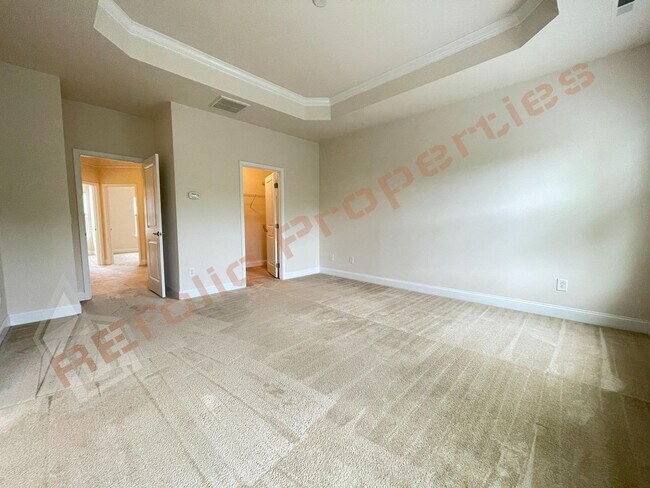 Building Photo - Beautiful 3 Story 3 Bedroom Townhouse with Huge 1st Floor Flex Space with Access to Patio + 2 Car...