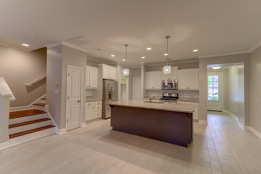 Kitchen and stairwell to second floor - 2069 Kings Gate Ln