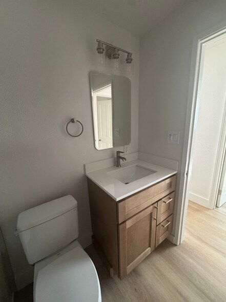 New bathroom vanity with quartz countertop - 3948 S Brandon St