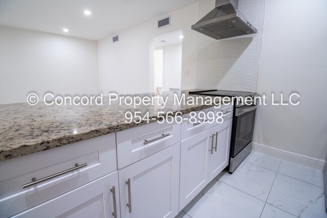 Building Photo - Holiday Special-Updated 2 BR- Open Layout- Island Kitchen-Pool- Central AC