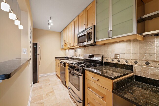 Building Photo - Spacious, and Sunlit 1 BD/1 BA Condo w/Reserved Garage Parking and Utilities Included in Chevy Ch...