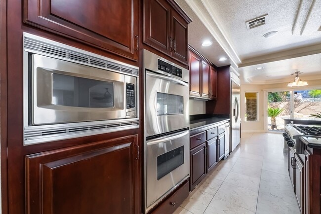 Building Photo - Beautiful Three Story, Five Bedroom Home with Lagoon Style Pool and Spa