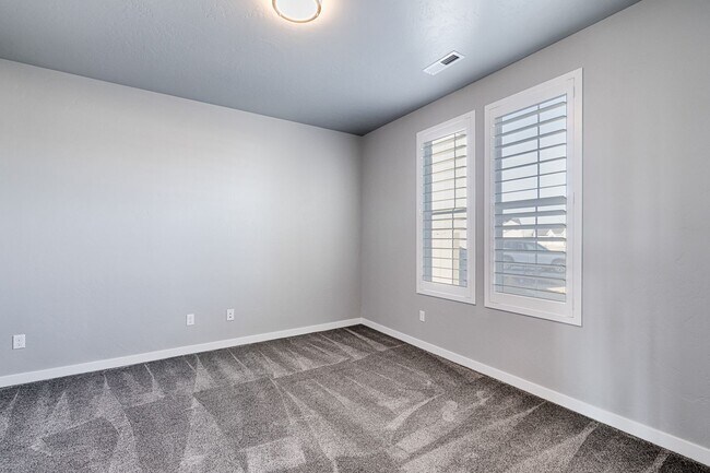 Building Photo - Custom Hunter-Douglas shutters throughout.