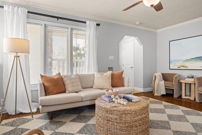 Building Photo - Welcome to this stunning 4-bedroom, 2-bath...