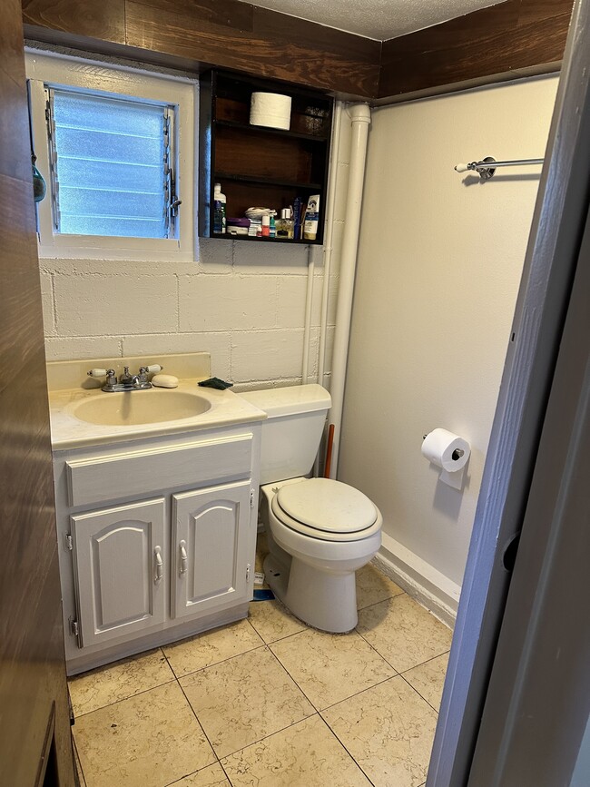 Shared bathroom with shower. - 2854 Booth Rd