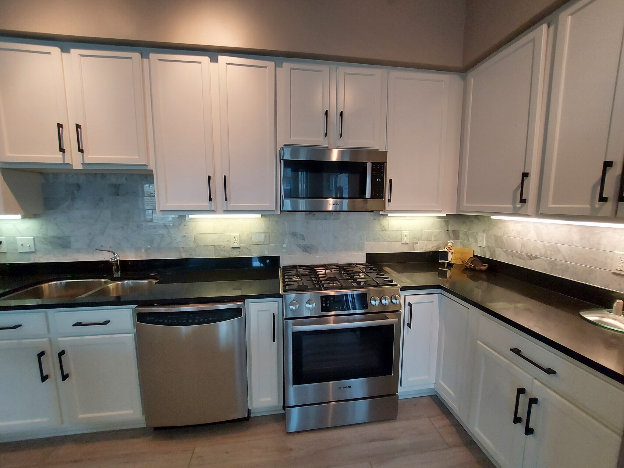 Updated Kitchen with White Cabinets - 500 E Grant St