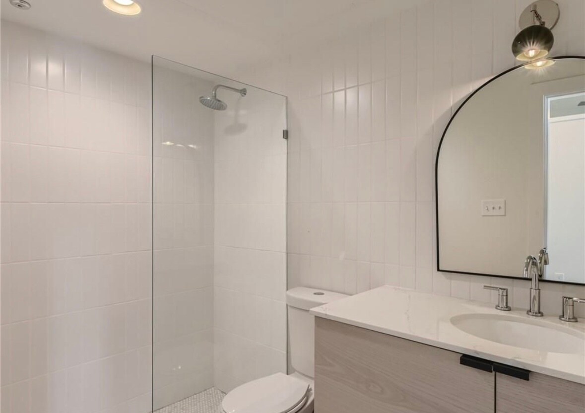 Tiled shower and bamboo stool. - 2906 S 1st St