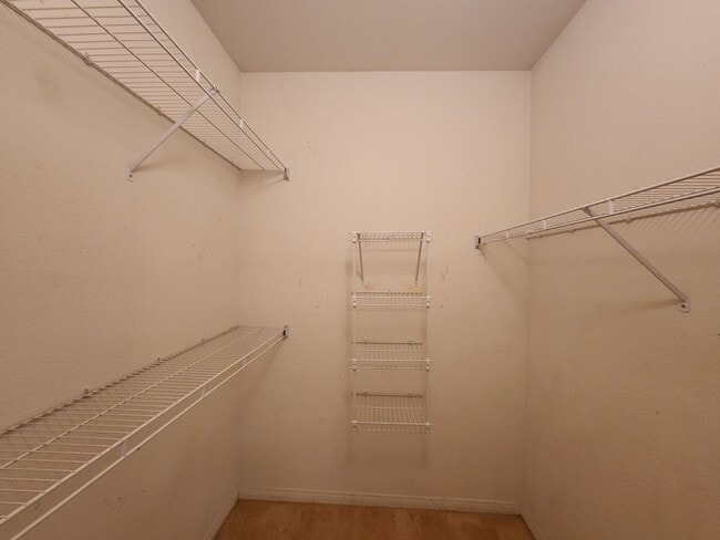 Building Photo - 2nd Story Condo in gated community close to the pool.